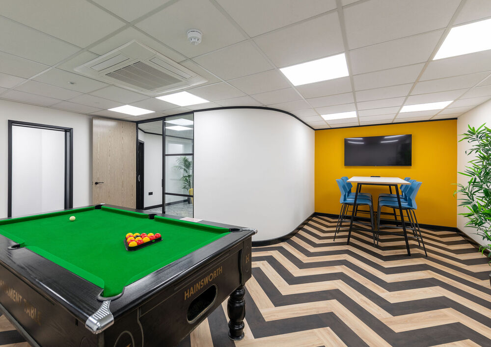 Pool table in modern office space